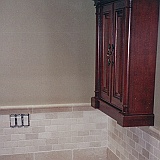 CUSTOM TUMBLED MARBLE BATHROOM.